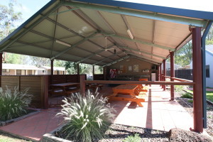 Campers can congregate beneath a sheltered camp kitchen at Deniliquin Riverside Caravan Park