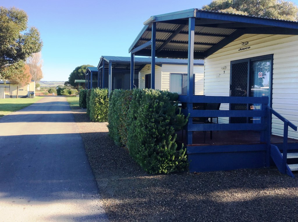 Manicured shrubs assure privacy for free-standing cabins at Goolwa Camping and Tourist Park