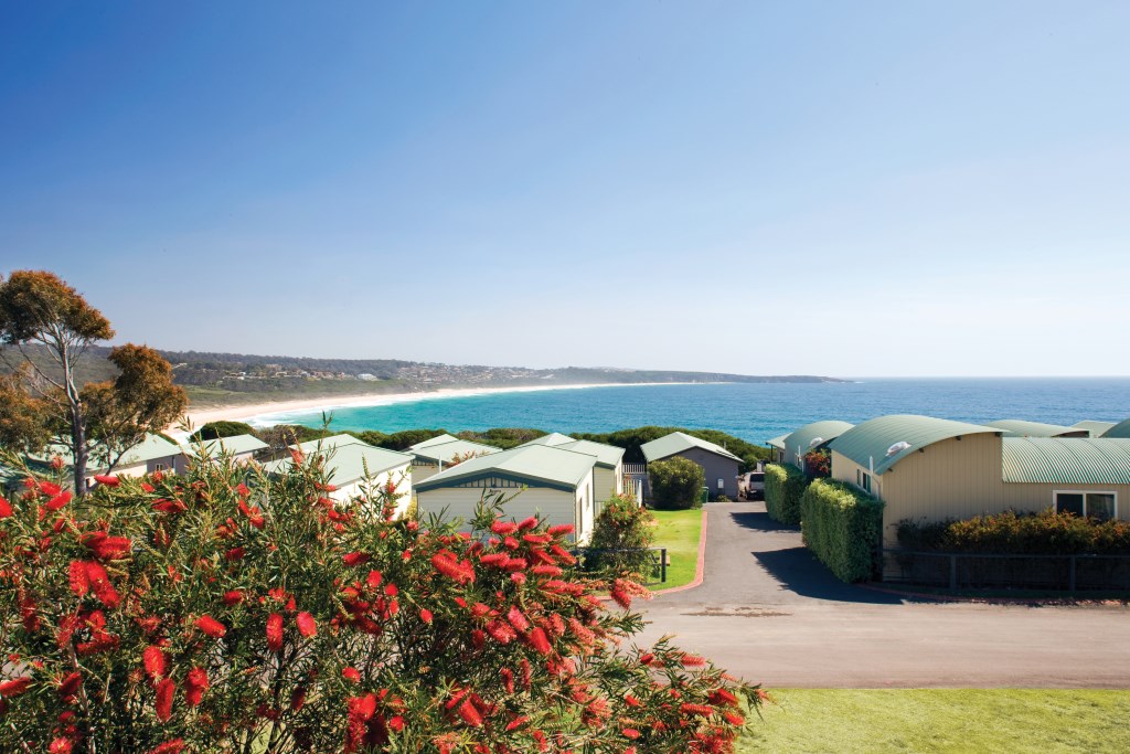 A row of cabins with views of the Sapphire Coast at Merimbula Beach Resort