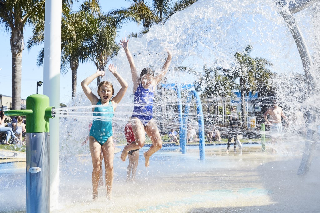 Kids enjoying the water splash play area at the Merimbula Beach Holiday Park