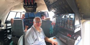 Volunteers Ray, Gerry and John inside the Super Constellation cockpit restored and home at the Qantas Founders Museum