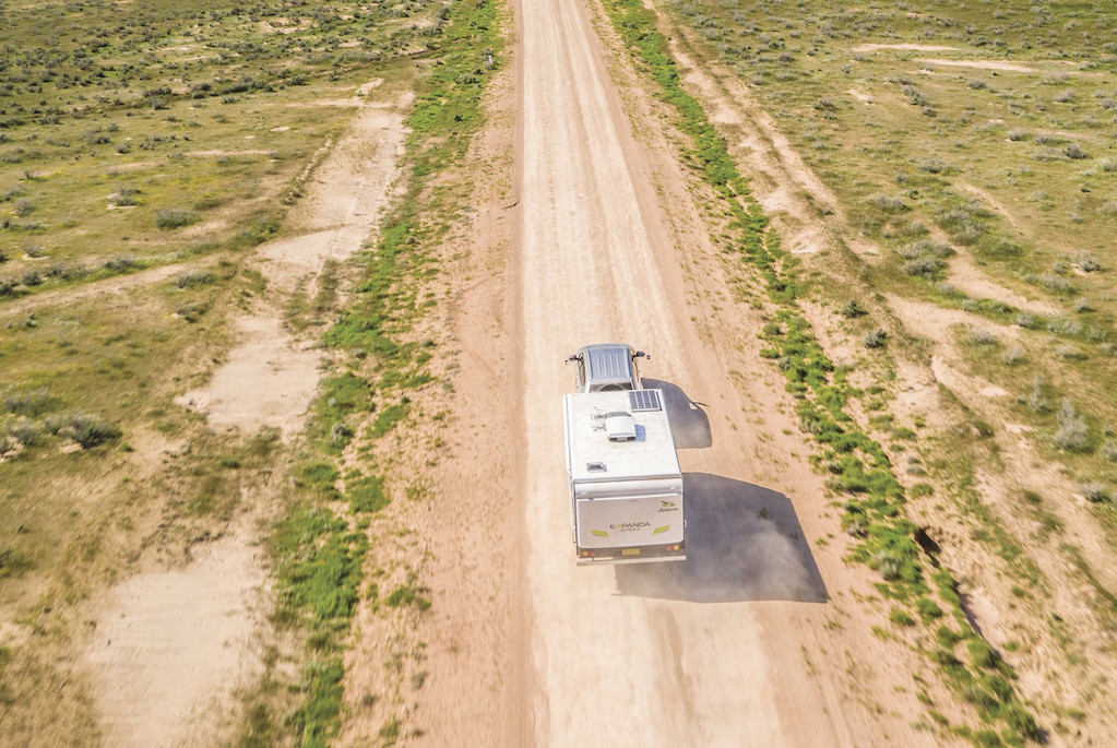 Major tourism partners A 4WD and caravan driving inside Mungo National Park.